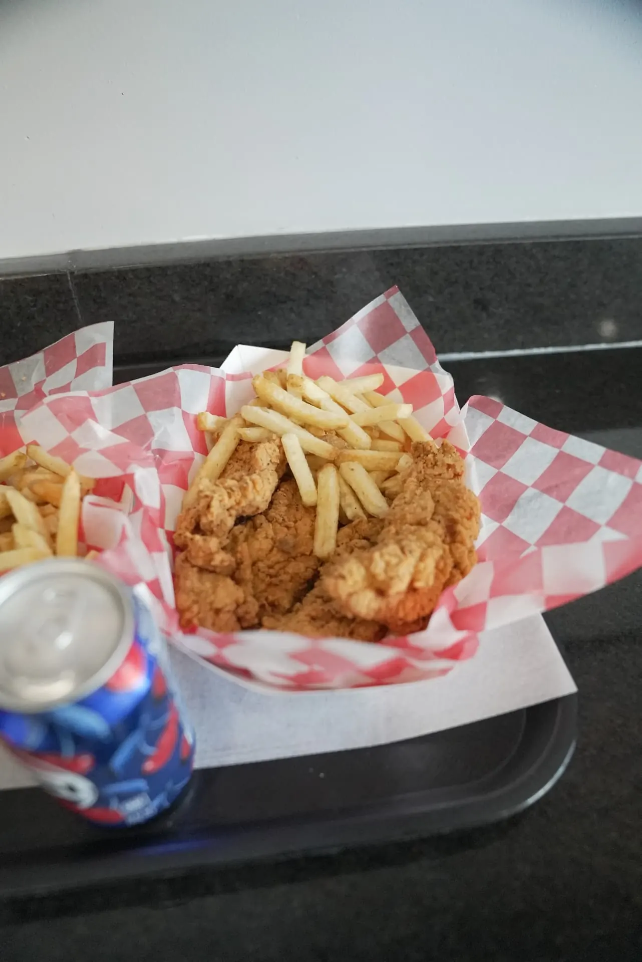 Basket of chicken tenders and hand-cut fries